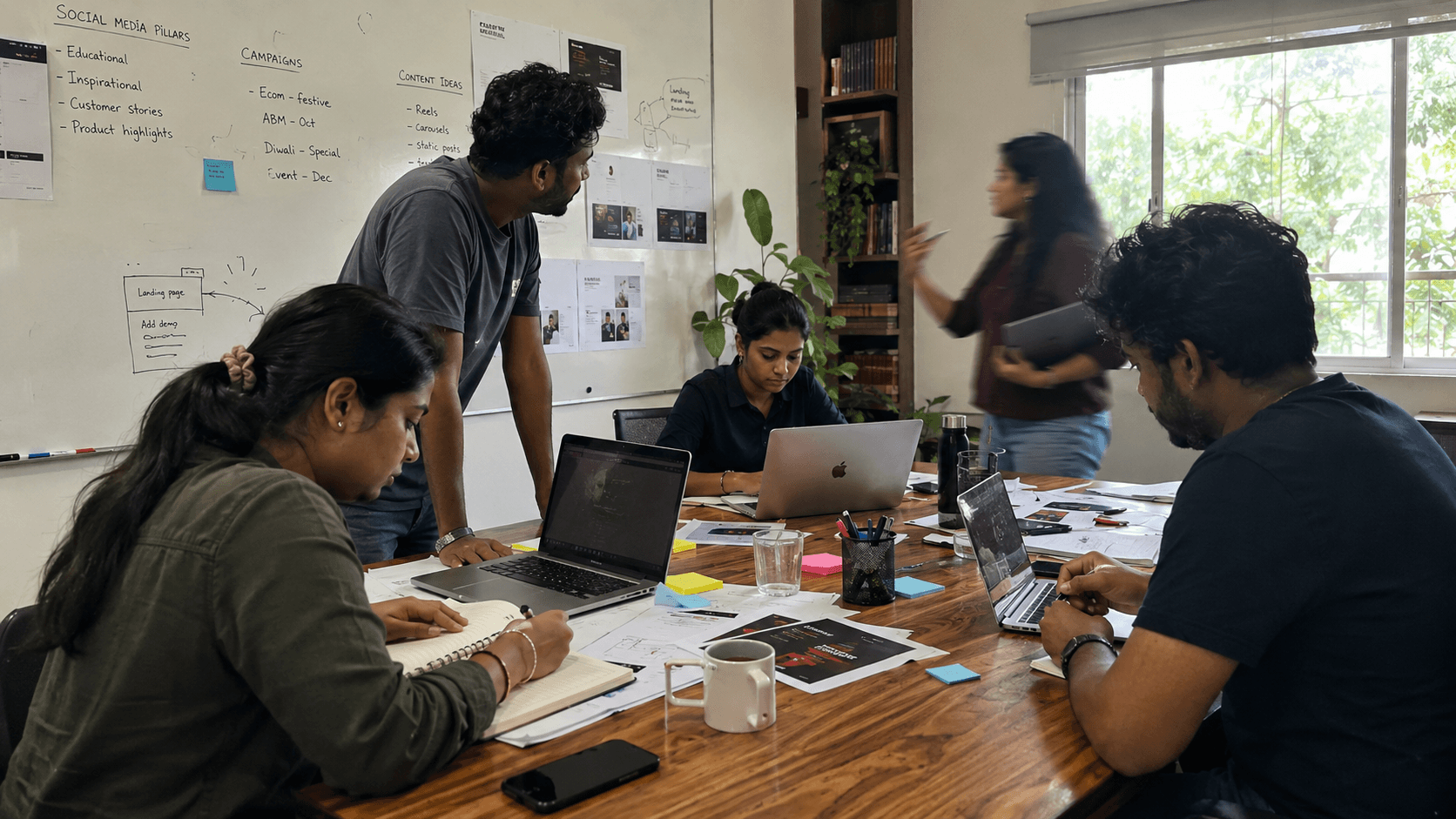 The Prachar Craft team at work around the studio table, planning social-media pillars on the whiteboard